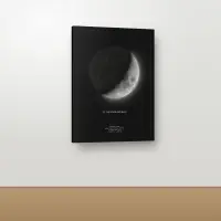 Moon phase canvas in the ink black theme on a light wall